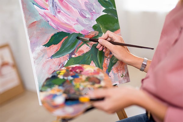 Art center. woman painting with acrylic