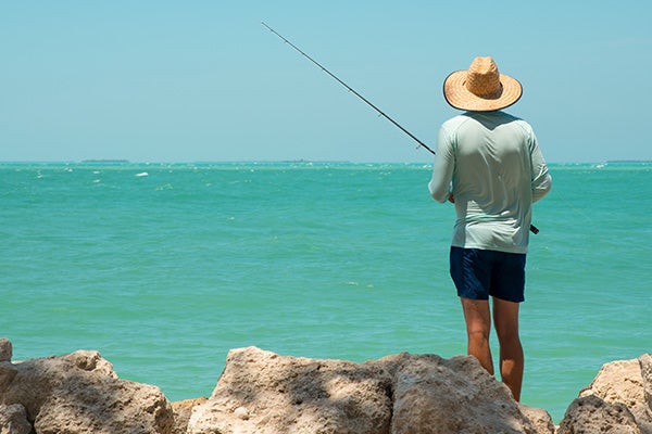 man fishing in the ocean