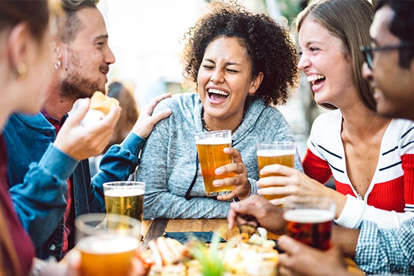 group of friends eating and drinking beer
